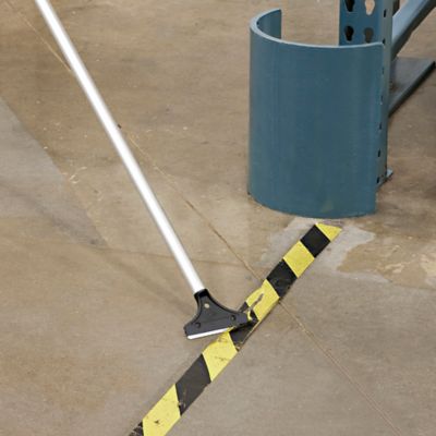 Concrete shop floor scraper