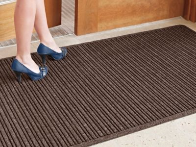 Can I put entrance mats on top of carpet?