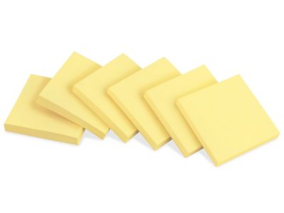 Yellow paper sticky note glued to the surface isolated on