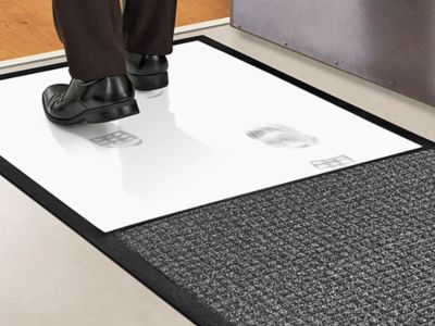 Tapis avec plaque nettoyante